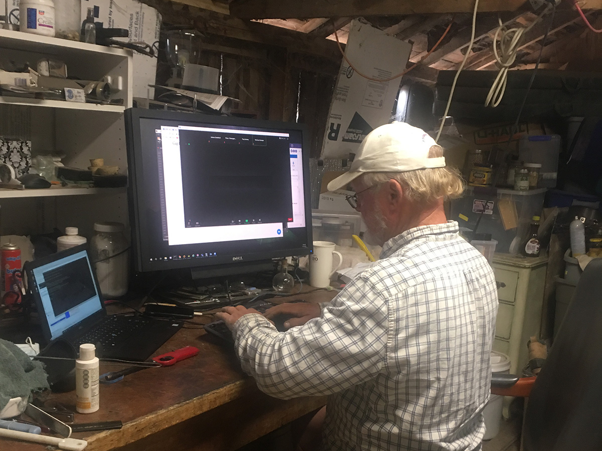 Jim working at his computer in the barn.